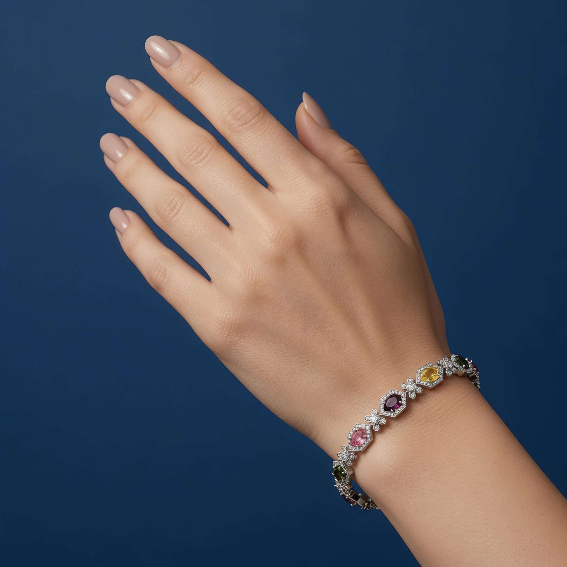Elegant geometric link bracelet featuring vibrant oval-cut simulated gems